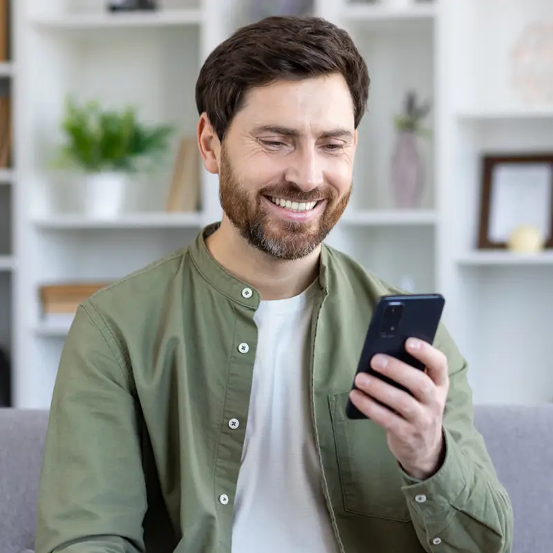 man-smiling-with-phone